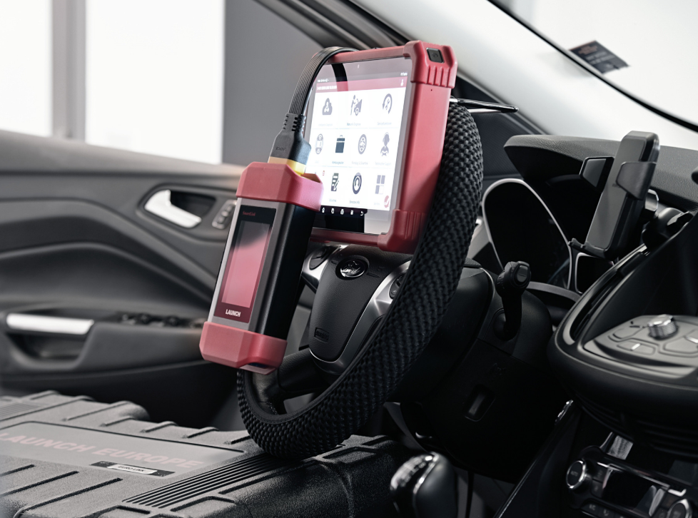 Launch X-431 Euro diagnostic tablet mounted inside a vehicle for advanced car diagnostics and system testing.
