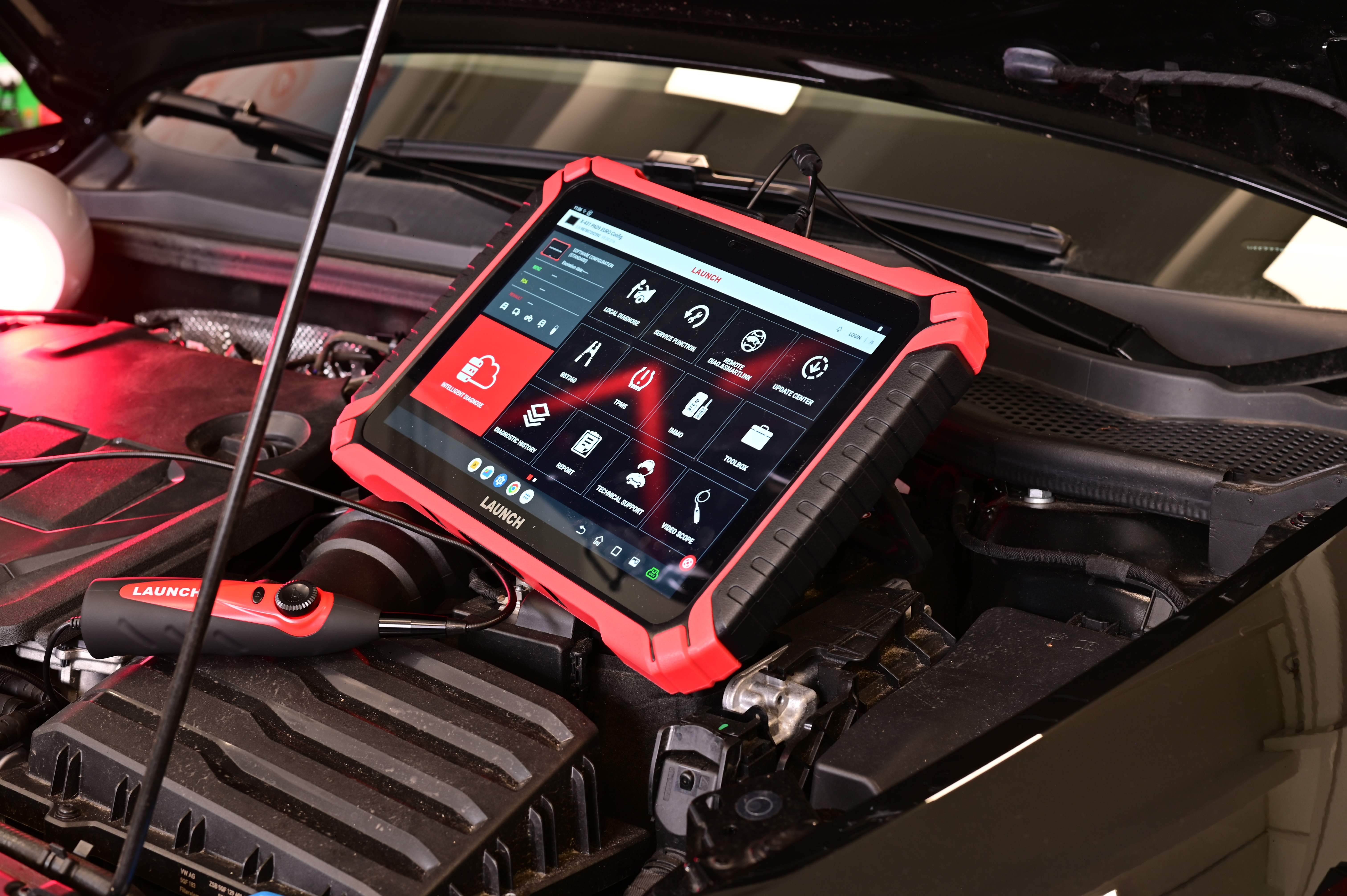 LAUNCH X-431 EURO diagnostic tablet connected to a vehicle for advanced garage diagnostics and fault detection.